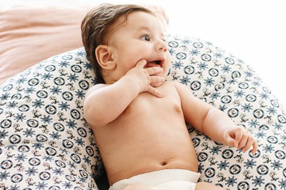 Baby chewing on his/her hand